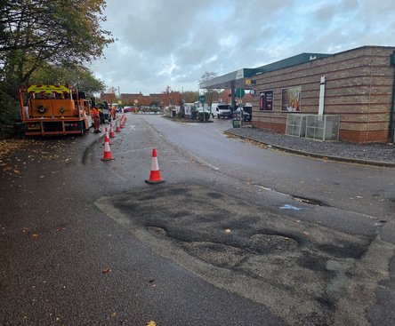 Failed asphalt patch causing repeat pothole repair issue